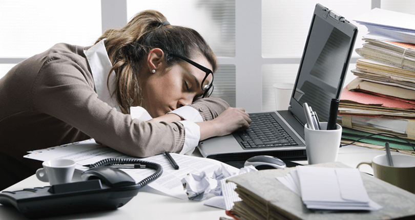 Tired businesswoman sleeping on the desk 810 x 430 Blog Popup | Saving your teachers from endless email onslaught and white bears