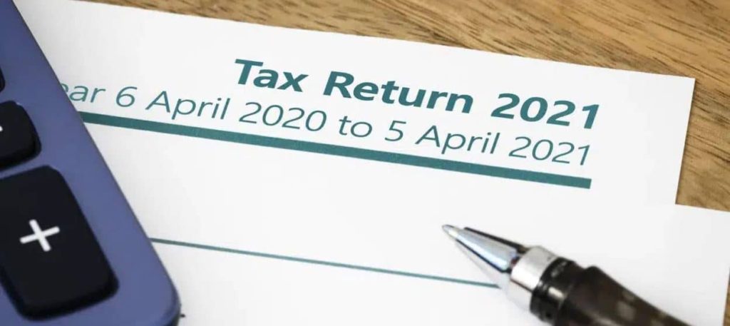 tax return document and pen - what is a tax return | IRIS