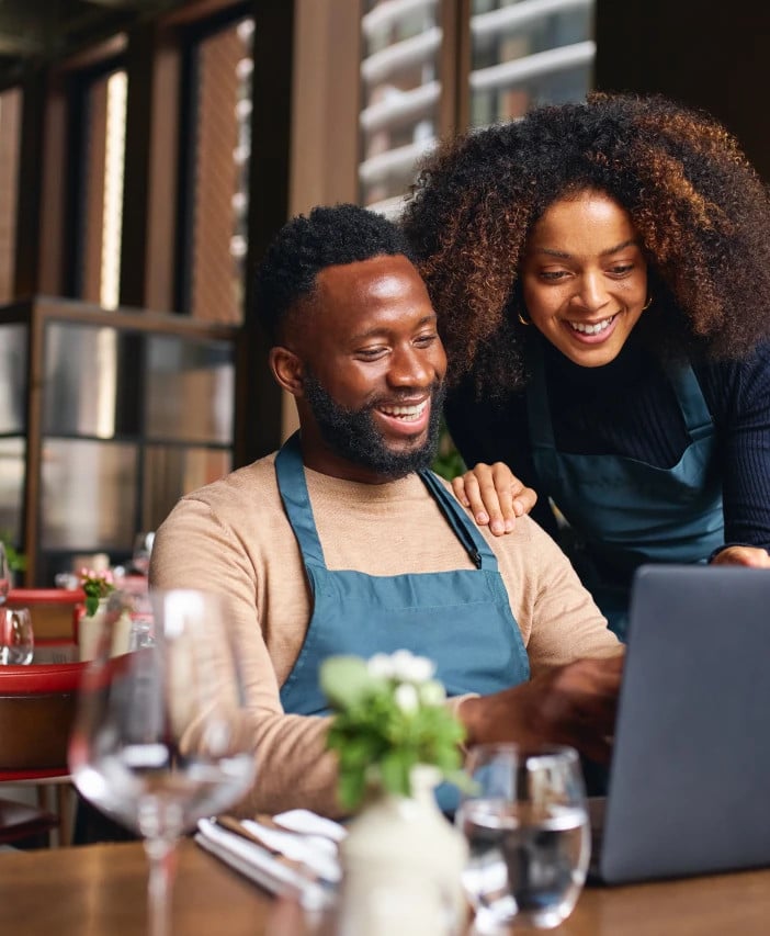 People looking at laptop