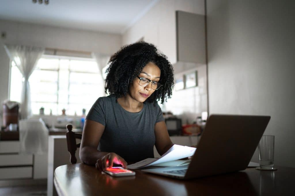 Woman working at home using VAT filing software