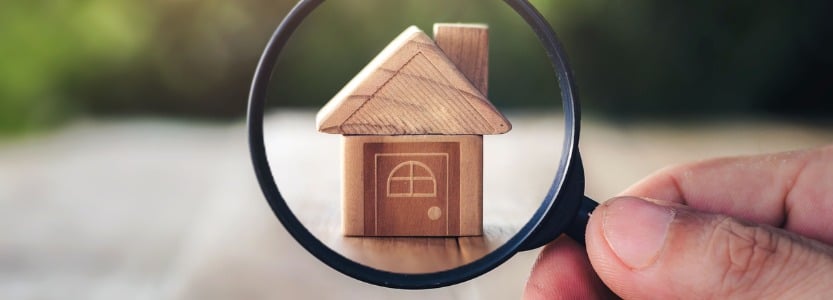 wooden houses and magnifying glass property valuation home appraisal choice of location | Do small businesses need in-house finance people?