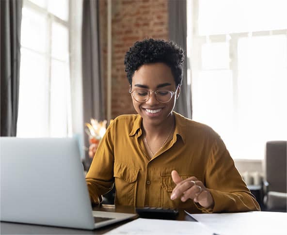 Woman smiling working at desk