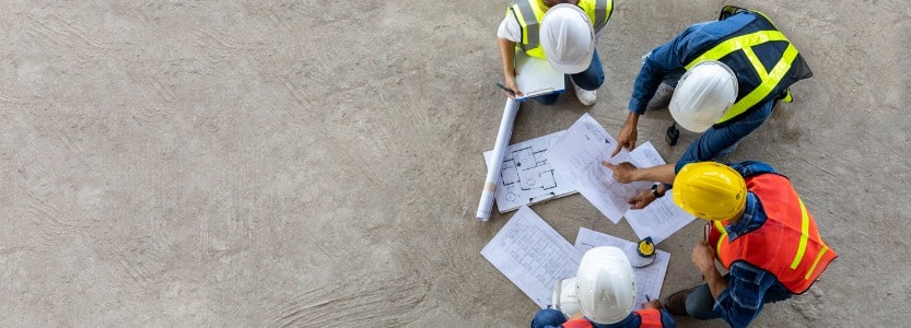 top view of engineer architect contractor and foreman meeting at the construction | How to lay the groundwork for a successful busy season