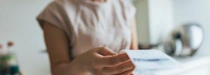 asian women examining the shopping receipt at home.jpg s1024x1024wisk20cpIc3fL6hLyS4dU5ZPa7Jfz0aKm QZjfE1Fzr2kaA8dU | Your Guide to Payroll Year End 2024