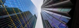 two modern skyscrapers with glass facades seen in perspective from below in nadir plane under.jpg s1024x1024wisk20cdd6PIjWKwMnbjVci1yh8t8KmarGcEvJjU620EknG3zw | How can a large accountancy firm grow without growing?