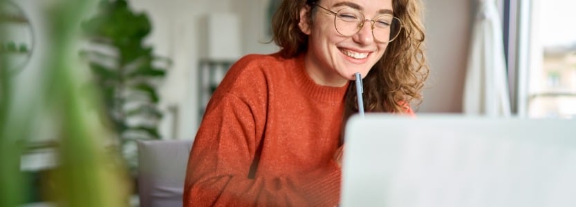 young happy woman student using laptop watching webinar writing at home.jpg s1024x1024wisk20cICSLSiYaIZ Cvk9MF3iF2JmrVRmE6br6dYjCEtyjLYs | Top tips for legal firms managing a hybrid workforce