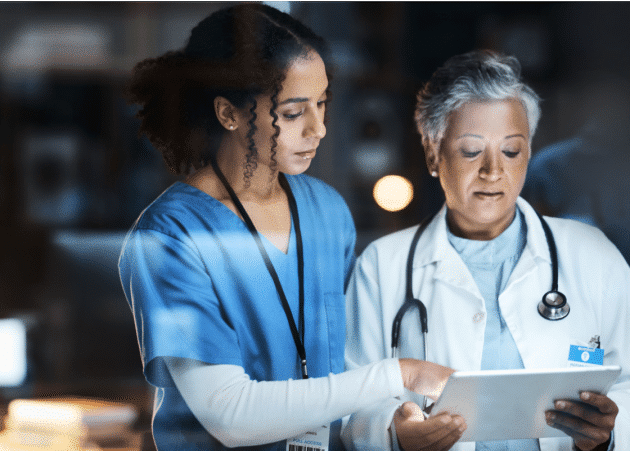 Doctors looking at notes