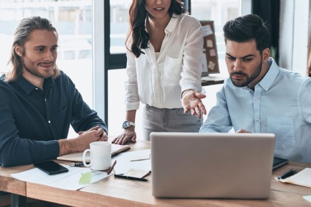 Team of people working on the same software | The Benefits of Human Resources (HR) Software