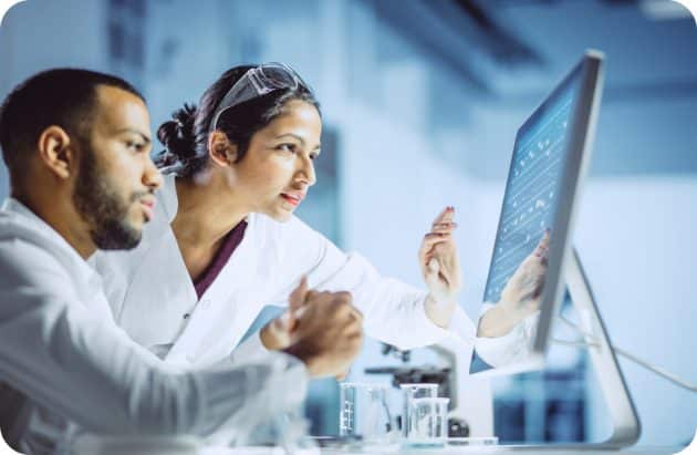Healthcare professionals looking at computer