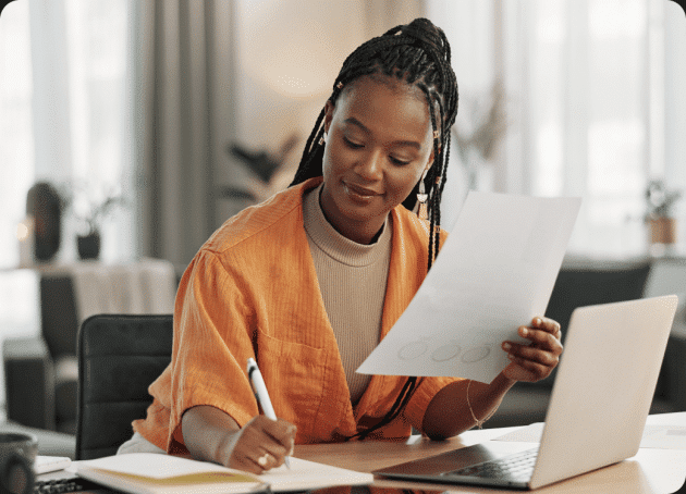 woman working paper work | Staffology Payroll Features and Integrations