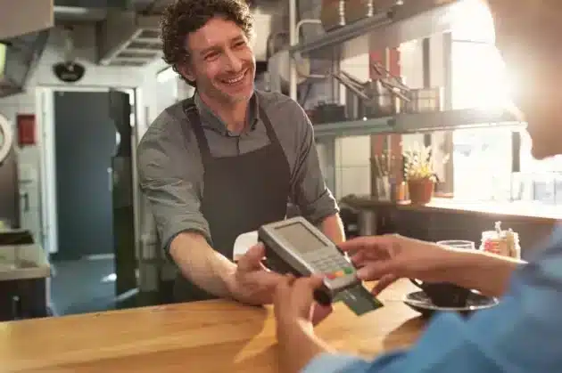 restaurant worker charging credit card | Tips and Gratuities