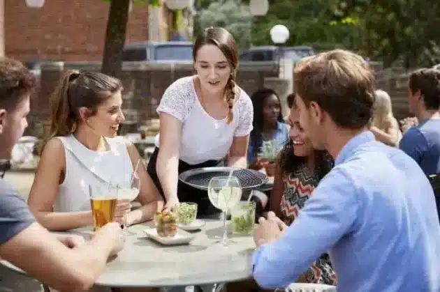 waitress serving table.jpg | Tips and Gratuities